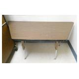 Rm 111B - Next room full - steel desk covered with wallpaper, table, stool, file cabinet