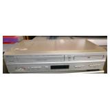 Rm 102 - Memorex VHS and DVD player 6-head