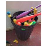 GymS- garbage barrel full of plastic baseball bats