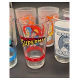 Simpsons 16oz Pint Glass Set - Assorted Characters (Homer, Moe, Batman, Superman) Simpsons 16oz Pint Glass Set - Assorted Characters (Homer, Moe, Batman, Superman)