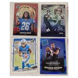 Lot of 7 Rookies and Inserts Football Cards Featuring Jahmyr Gibbs, Jaxon Smith-Njigba, Baker Mayfield, Trevor Lawrence, Deshaun Watson, and Jeremiah Trotter Jr. Lot of 7 Rookies and Inserts Football Cards Featuring Jahmyr Gibbs, Jaxon Smith-Njigba, Baker Mayfield, Trevor Lawrence, Deshaun Watson, and Jeremiah Trotter Jr.