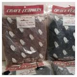 Lot of four packages craft feathers, All purpose fluffs, decorate and craft, florals, wreaths, fans, brooms, dolls, birds, animal novelties.