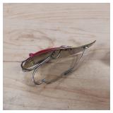 Two-piece lot of fish trap, weedless, snagless, spoon lures.