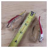 Two-piece lot of fish trap, weedless, snagless, spoon lures.