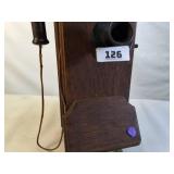 Antique Western Electric oak cased wall-mounted crank telephone, commonly used in the early 20th century