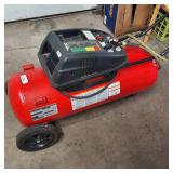 Husky Verti-Zontal 26-gallon air compressor with the model number WL650702AJ.