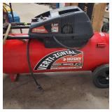 Husky Verti-Zontal 26-gallon air compressor with the model number WL650702AJ.