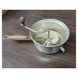 Vintage Foley food mill, commonly used for mashing and straining foods like applesauce or tomatoes