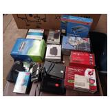 Large Lot  collection of electronic networking and media hardware, including several Slingbox devices, a digital-to-analog converter box, and various routers/modems