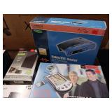 Large Lot  collection of electronic networking and media hardware, including several Slingbox devices, a digital-to-analog converter box, and various routers/modems