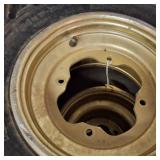 Set of used ATV tires mounted on gold-colored rims
