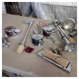 Lot of boat parts, primarily chrome accessories including spotlights, navigation lights, and a horn