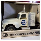 Vintage Nylint NAPA Auto Parts Pressed Steel Semi-Truck and Trailer toy, often found in a white box with 'The standard is quality' branding.