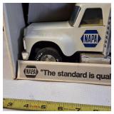 Vintage Nylint NAPA Auto Parts Pressed Steel Semi-Truck and Trailer toy, often found in a white box with 'The standard is quality' branding.
