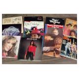 Large collection of vintage music vinyl records featuring artists like Laura Branigan and The Ink Spots
