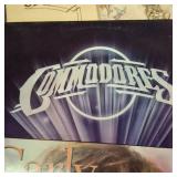 Large collection of vintage music vinyl records featuring artists like Laura Branigan and The Ink Spots