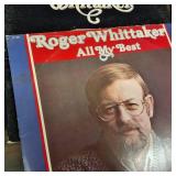 Large collection of vintage music vinyl records featuring artists like Laura Branigan and The Ink Spots