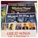 Large lot of vintage vinyl records featuring various artists and genres from the mid-20th century