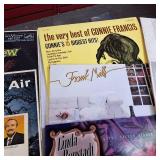 Large lot of vintage vinyl records featuring various artists and genres from the mid-20th century