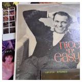 Large lot of vintage vinyl records featuring various artists and genres from the mid-20th century