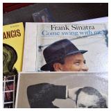 Large lot of vintage vinyl records featuring various artists and genres from the mid-20th century