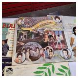 A collection of vintage vinyl records from various artists and genres.