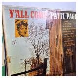 A collection of vintage vinyl records from various artists and genres.