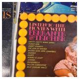 A collection of vintage vinyl records from various artists and genres.