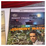 A collection of vintage vinyl records from various artists and genres.