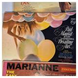 A collection of vintage vinyl records from various artists and genres.