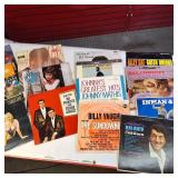 A  large collection of vintage vinyl records from artists like Johnny Mathis, Billy Vaughn, Ray Conniff, and Dean Martin