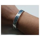 Vintage Taxco Mexico sterling silver crushed blue stone inlay - Hinged cuff bracelet with a geometric or Aztec design.