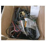 Large collection of various electronic cables, connectors, and a boxed electronic devices