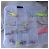 Fishing tackle bag set Okeechobee Fats soft-sided tackle bag paired with clear plastic utility trays chock full of various fishing lures.