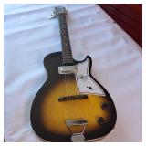 Vintage 1960s Harmony Stratotone electric guitar - highly collectible instrument.