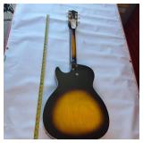 Vintage 1960s Harmony Stratotone electric guitar - highly collectible instrument.