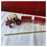 Vintage Ertl 1/16 scale International Harvester 1586 farm tractor toy plus two vintage tin hay wagons