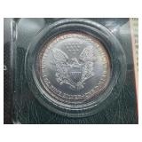 1999 Uncirculated American Silver Eagle in sealed Littleton holder 1999 Uncirculated American Silver Eagle in sealed Littleton holder