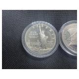 Two Commemorative Silver Dollars: 1986-S Proof Statue of Liberty and 1987-S Uncirculated 'We The People' Two Commemorative Silver Dollars: 1986-S Proof Statue of Liberty and 1987-S Uncirculated 'We The People'
