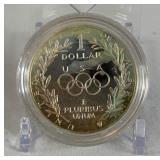 1988 S-Olympic Commemorative Silver Dollar - just the coin in a protective plastic case 1988 S-Olympic Commemorative Silver Dollar - just the coin in a protective plastic case