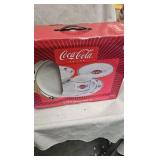 Coca Cola Dishes , and unopened tin with railroad toy on top Coca Cola Dishes , and unopened tin with railroad toy on top