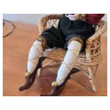 Santa Claus Sitting on a Wicker Chair Figurine by Band Creations