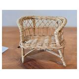 Santa Claus Sitting on a Wicker Chair Figurine by Band Creations