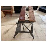 Adjustable folding work bench