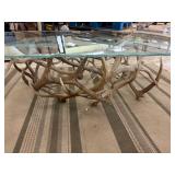 Glass Top Coffee table with authentic antler base. Buck scene etching on top