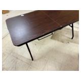 Brown top folding table