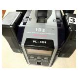 Recharchable battery pack stand w/5 batteries and random cords/tech