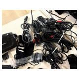 Recharchable battery pack stand w/5 batteries and random cords/tech