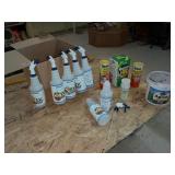 Assortment of spray bottles and chemicals
