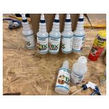 Assortment of spray bottles and chemicals